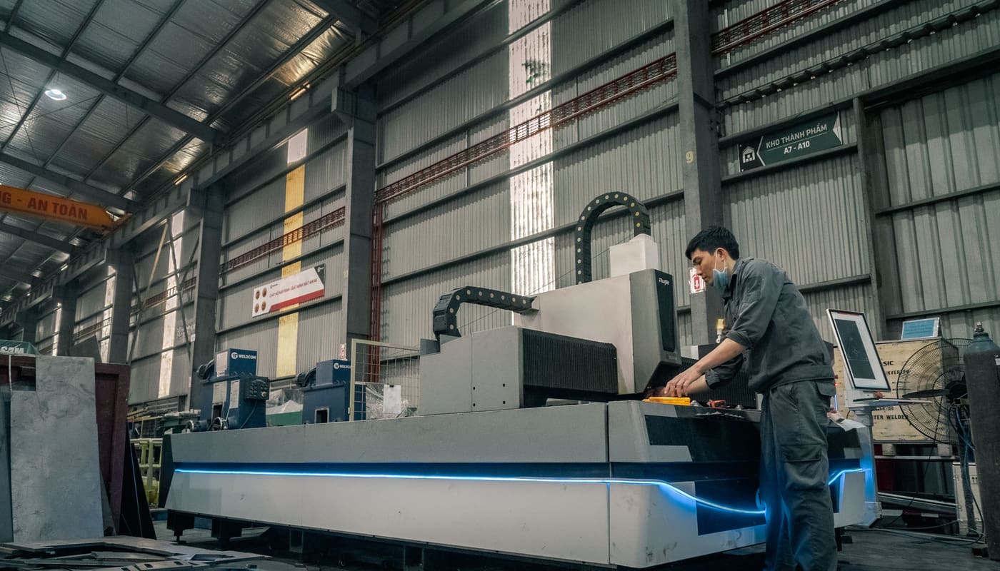 Operator working with an industrial fabrication machine